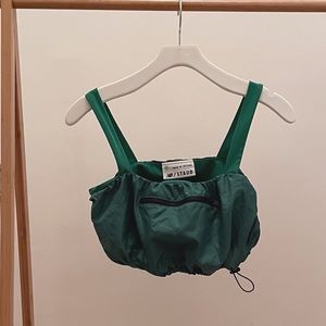 New Balance x Staud green top